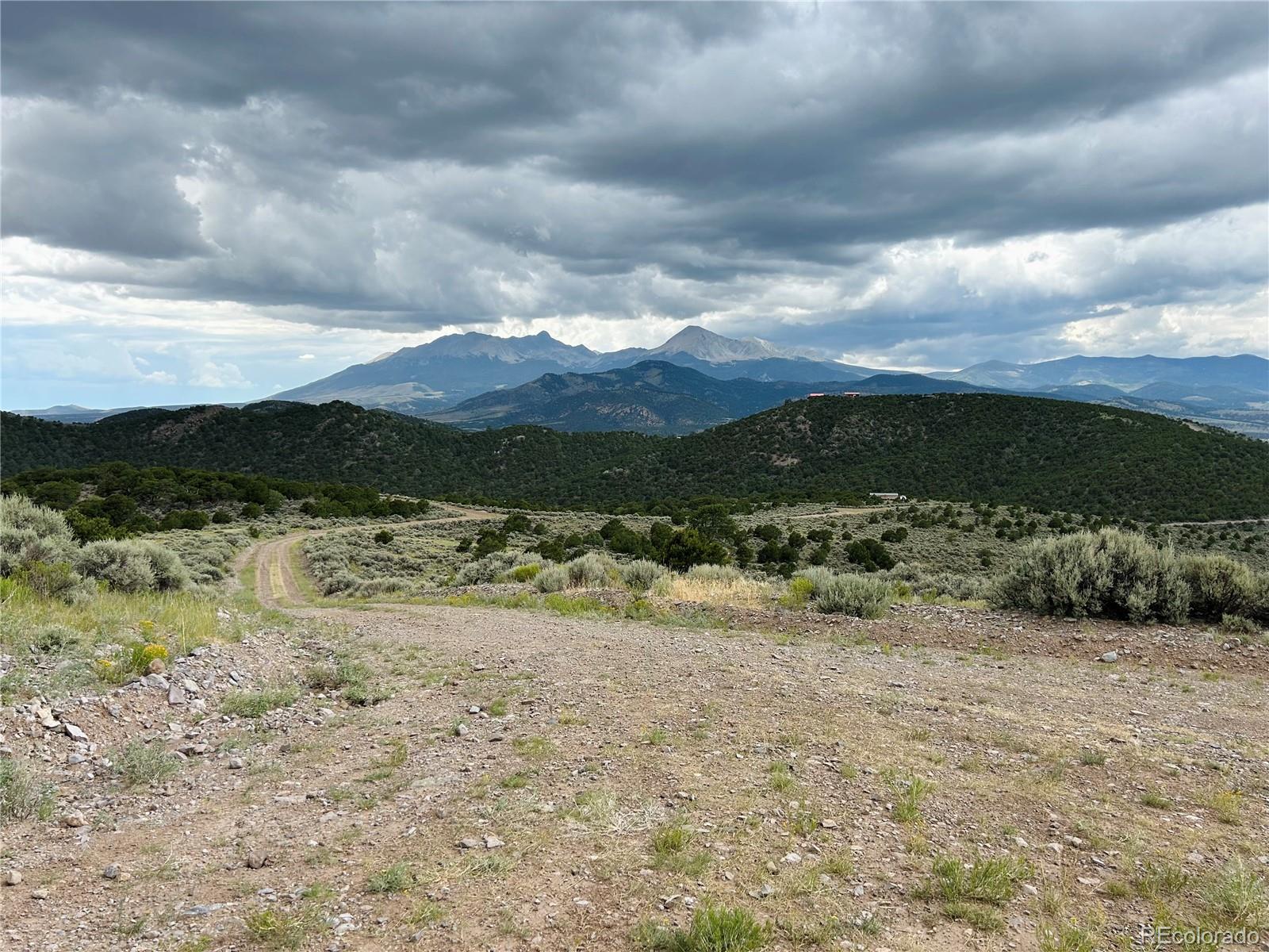 4535 Sarnoff Road Fort Garland, CO 81133 - Photo 31 of 44 a view of a yard with a lake