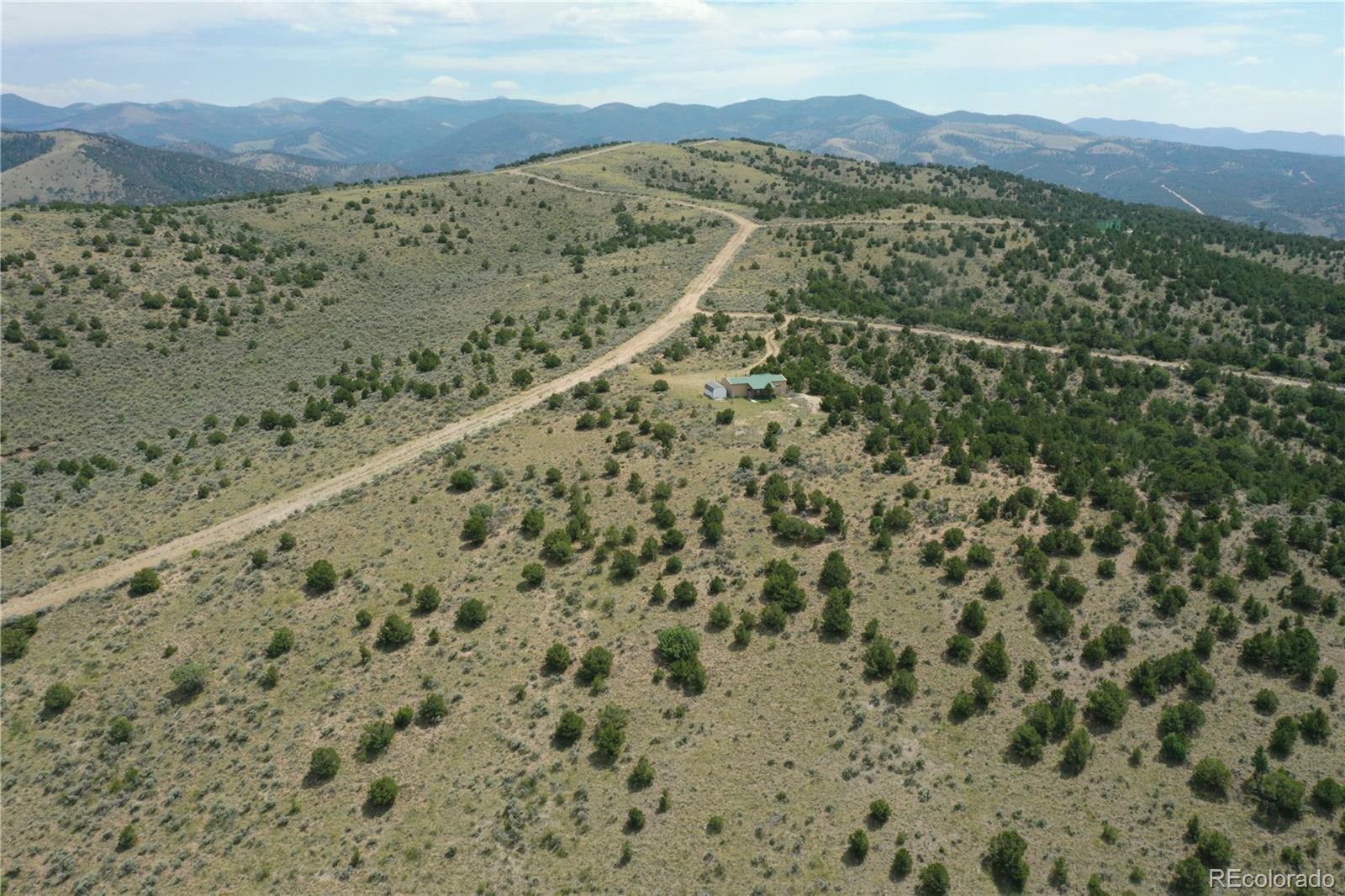 4535 Sarnoff Road Fort Garland, CO 81133 - Photo 34 of 44 a view of a field with a mountain in the background