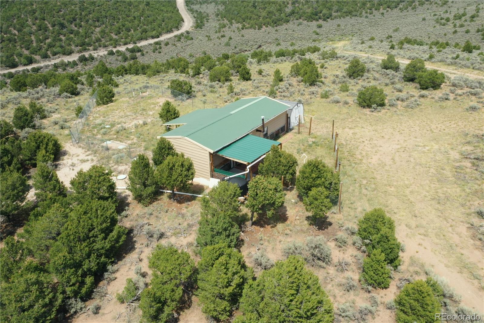 4535 Sarnoff Road Fort Garland, CO 81133 - Photo 42 of 44 an aerial view of residential house with outdoor space
