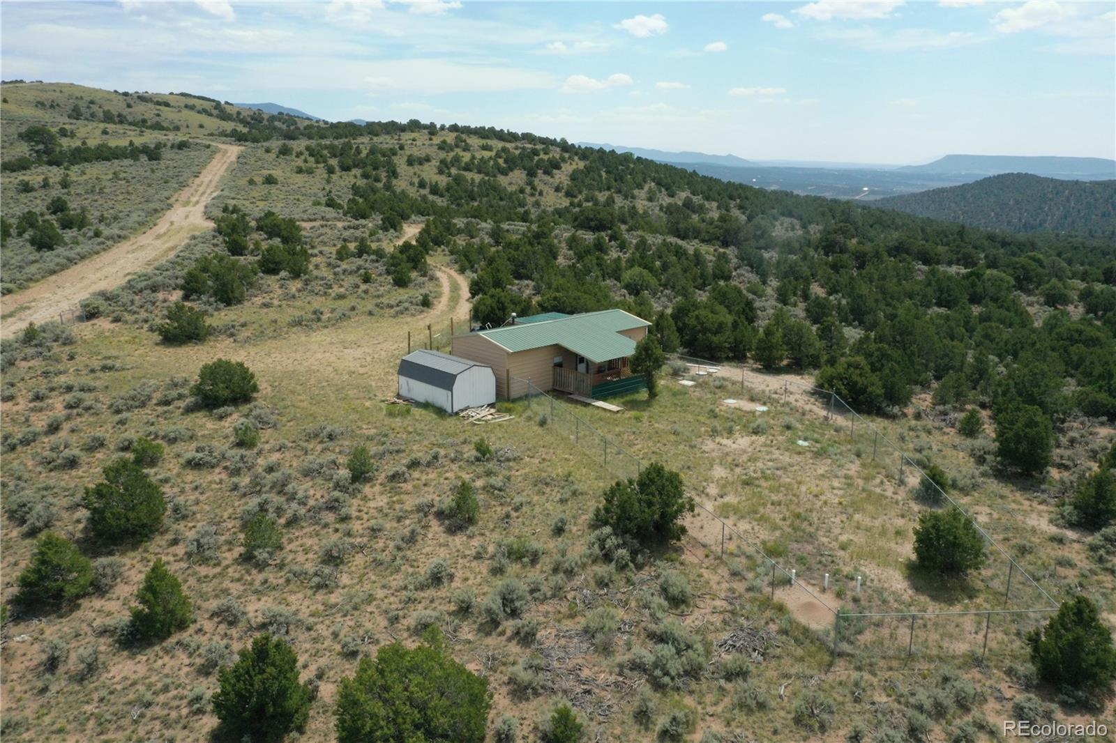 4535 Sarnoff Road Fort Garland, CO 81133 - Photo 44 of 44 a view of a mountain with a field