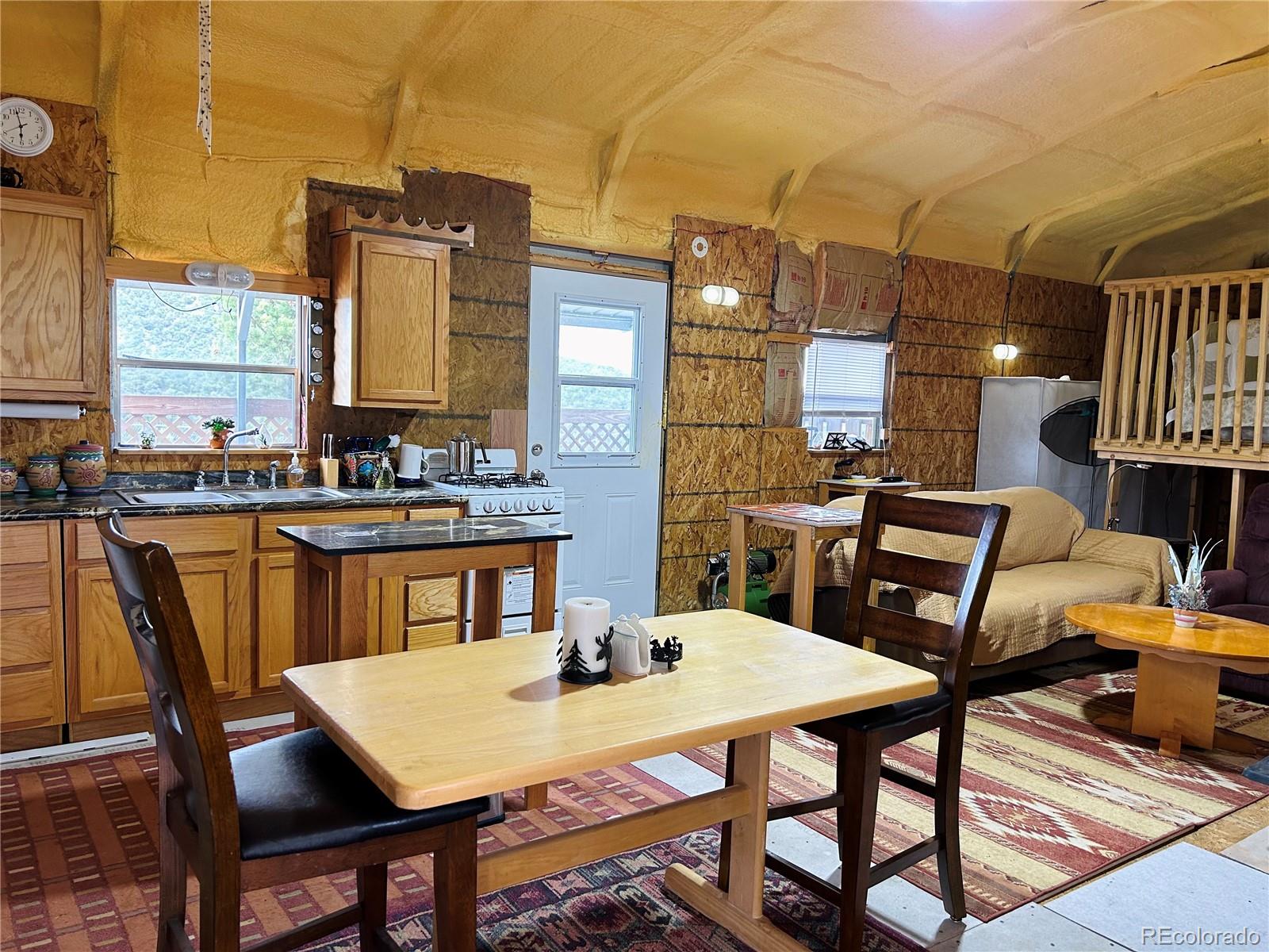 4535 Sarnoff Road Fort Garland, CO 81133 - Photo 7 of 44 a view of a dining room with furniture and window