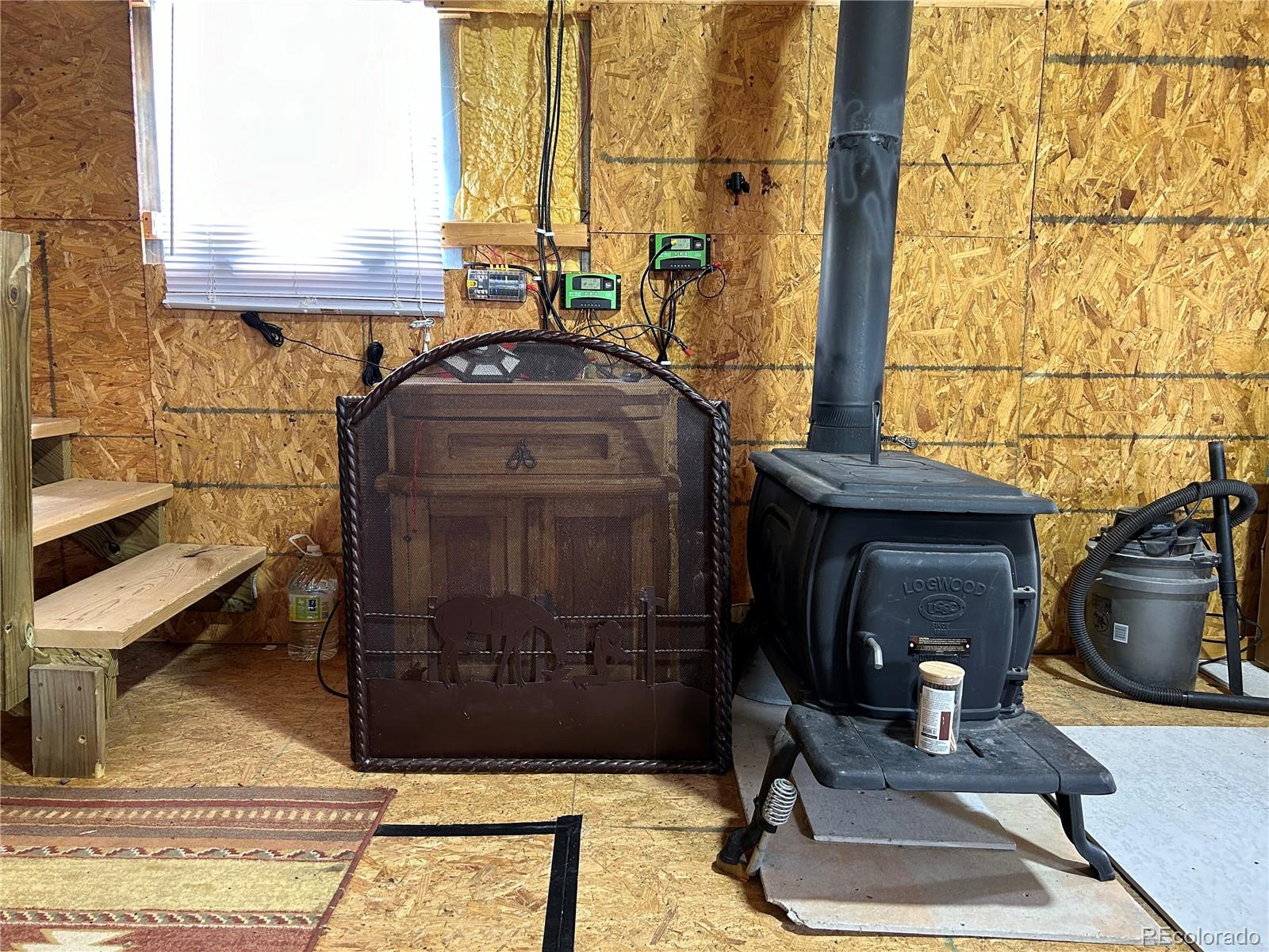 4535 Sarnoff Road Fort Garland, CO 81133 - Photo 9 of 44 a room with a mirror on the wall and a window