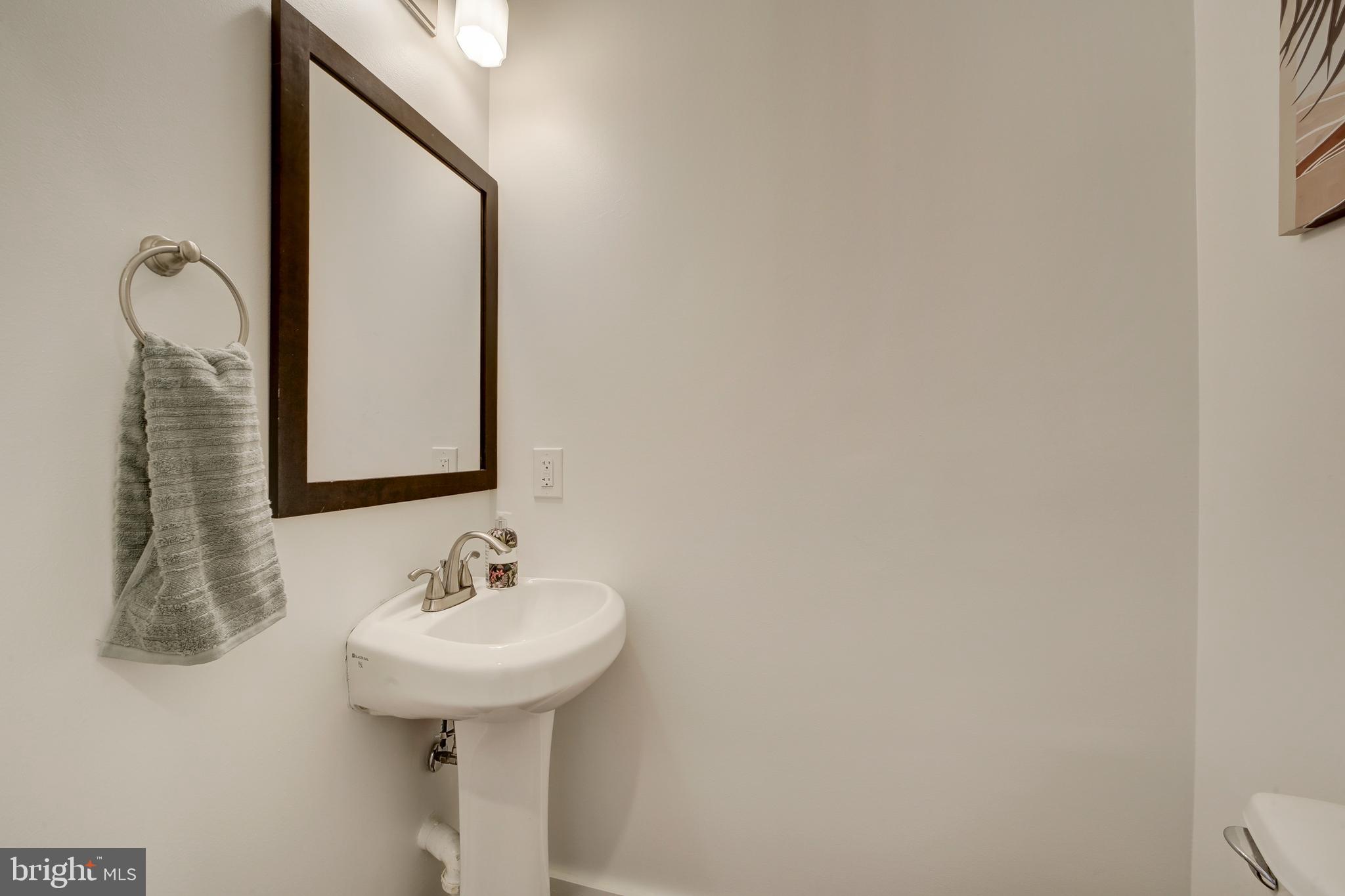 2012 2nd Street Northwest Washington, DC 20001 - Photo 17 of 28 a bathroom with a sink and a mirror