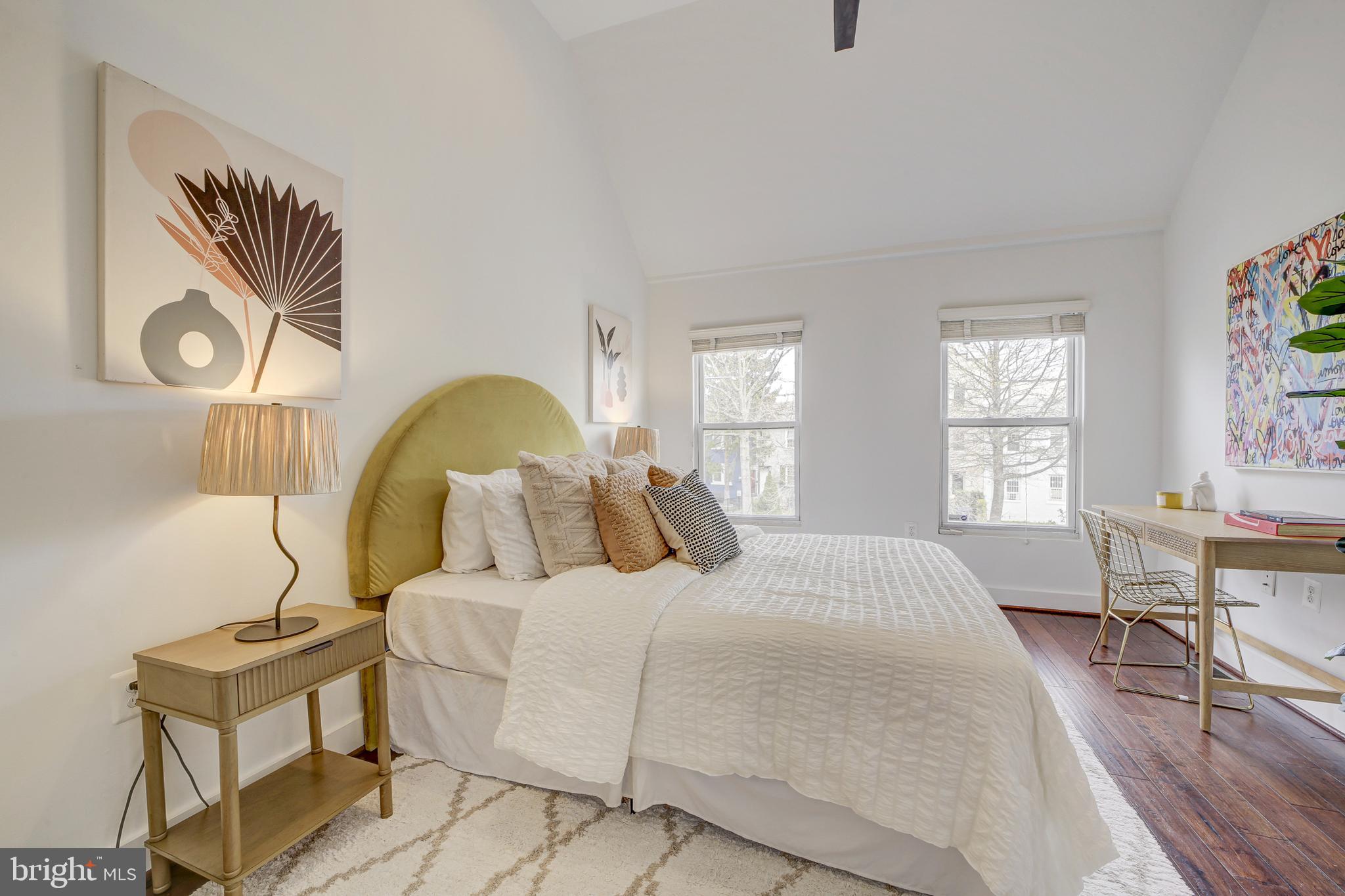 2012 2nd Street Northwest Washington, DC 20001 - Photo 18 of 28 a bedroom with a bed and wooden floor