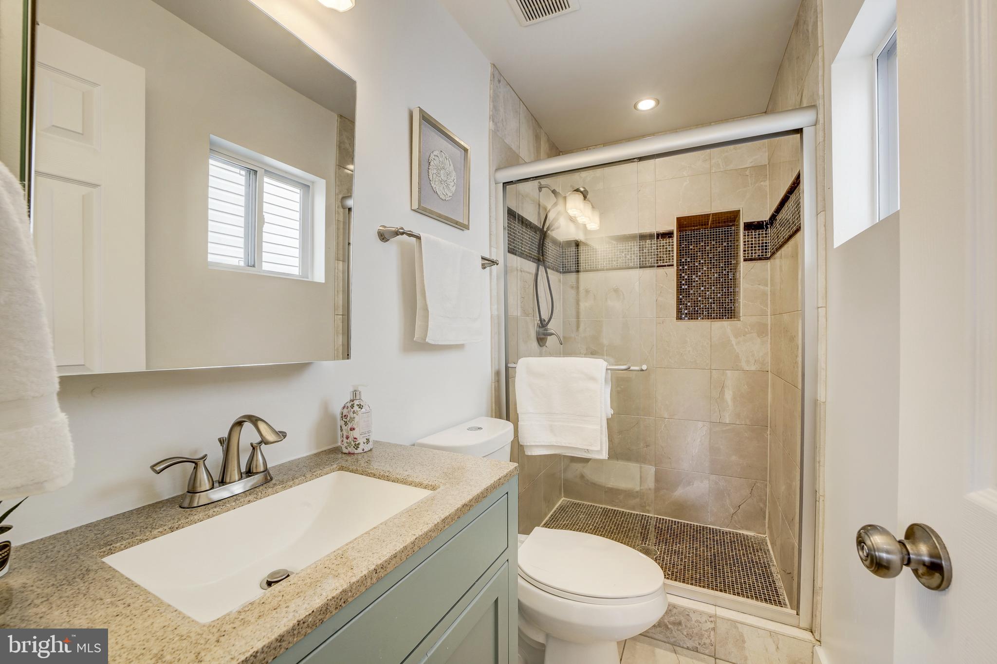 2012 2nd Street Northwest Washington, DC 20001 - Photo 20 of 28 a bathroom with a granite countertop sink toilet and shower