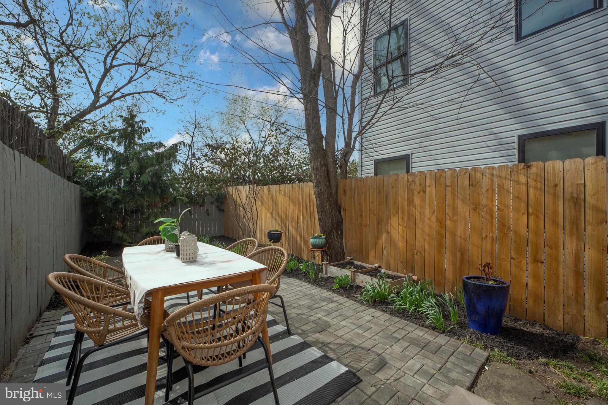 2012 2nd Street Northwest Washington, DC 20001 - Photo 25 of 28 a view of a patio with table and chairs with wooden fence and plants