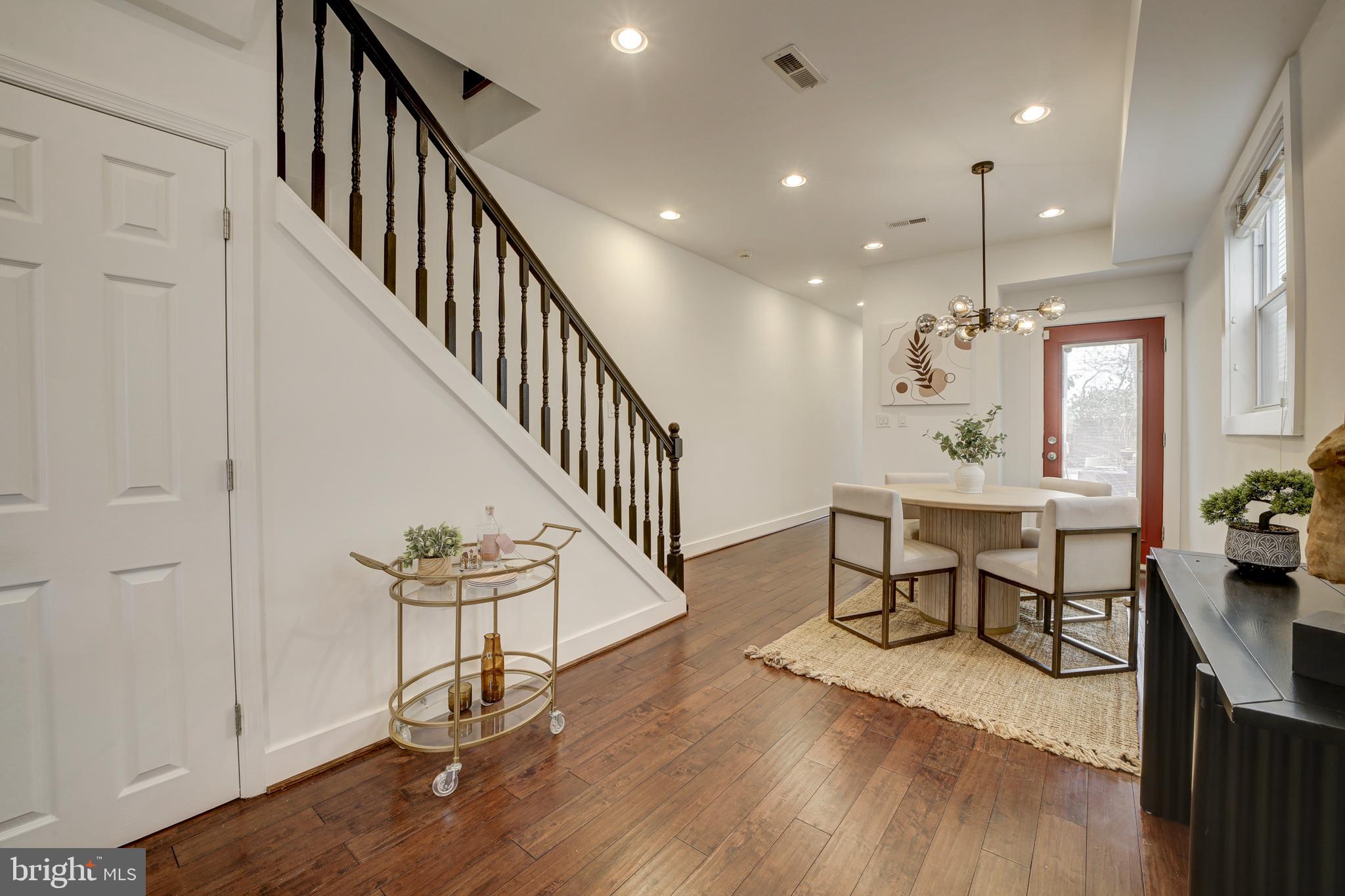 2012 2nd Street Northwest Washington, DC 20001 - Photo 10 of 28 a view of a dining room with furniture a rug and wooden floor