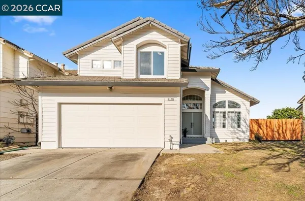 a front view of a house with a garage