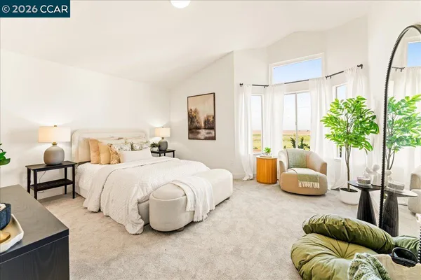 a bedroom with bed and a couch