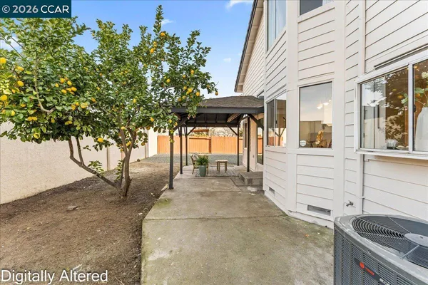 a view of a backyard of the house