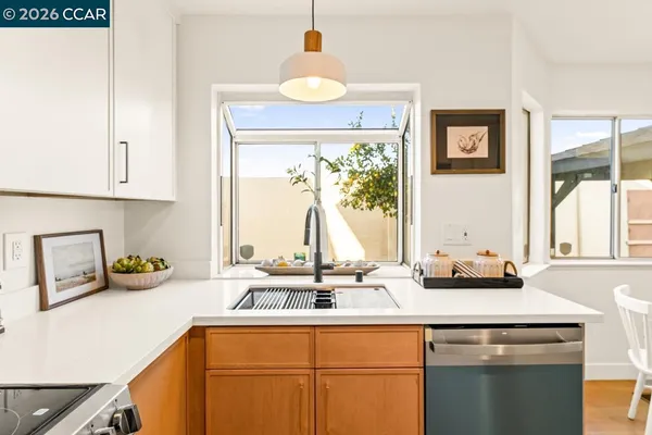 a kitchen with a sink and a window