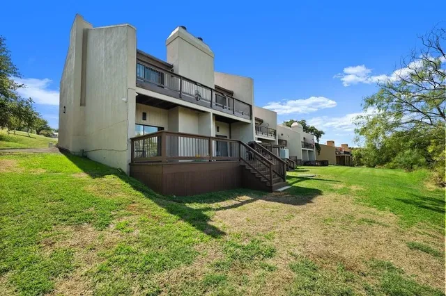 a view of a back yard of the house