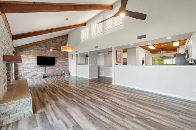 a view of a living room a flat screen tv