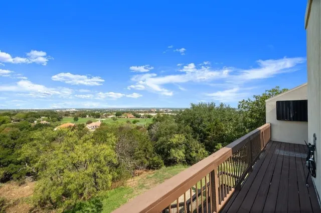 a view of a balcony with city view