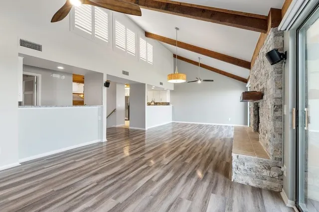 a view of a hallway view with wooden floor and staircase