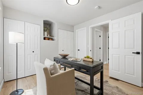 a dining room with a table and chairs