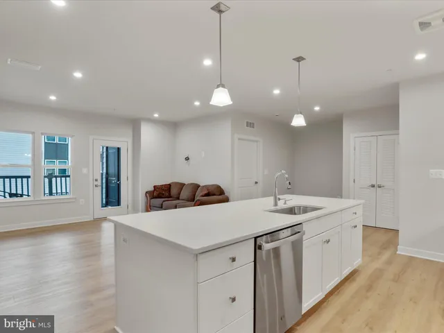 a living room with furniture window and wooden floor