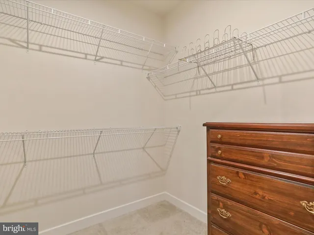 a bedroom with a bed and a television