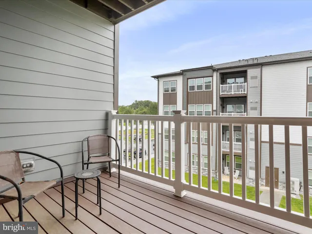 a view of balcony with furniture