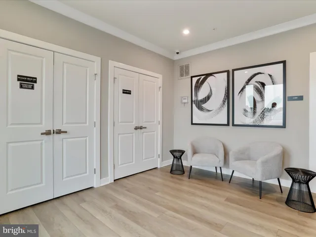 a view of room with furniture and wooden floor