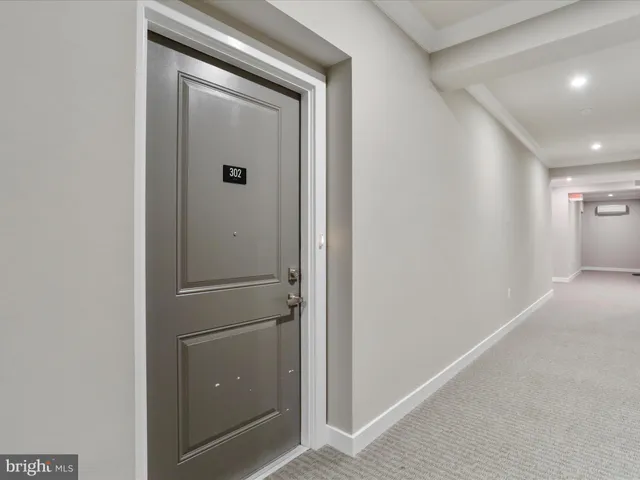 a kitchen with kitchen island a sink stainless steel appliances and cabinets