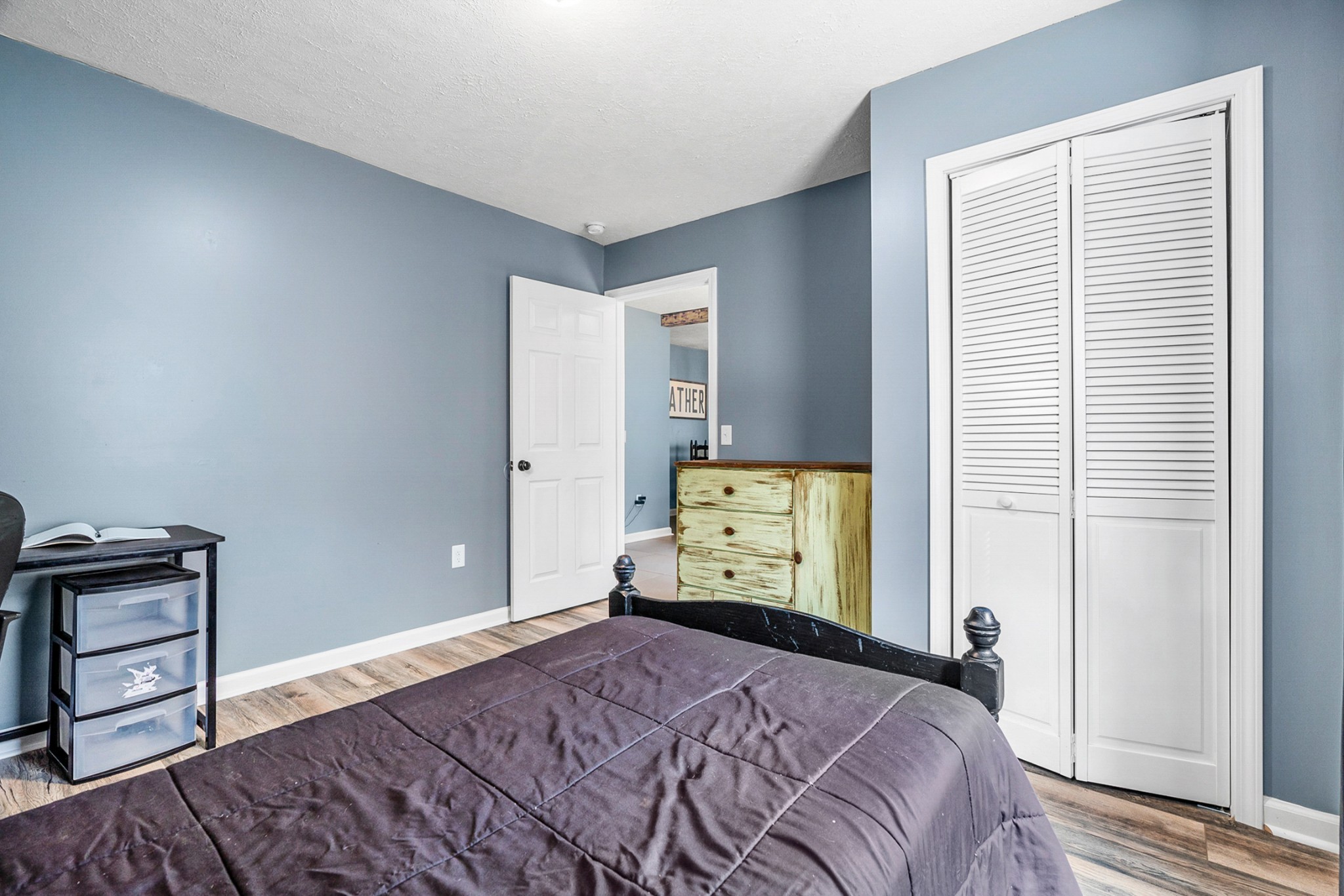 425 South Young Street Sparta, TN 38583 - Photo 20 of 34 a bedroom with a bed and wooden floor