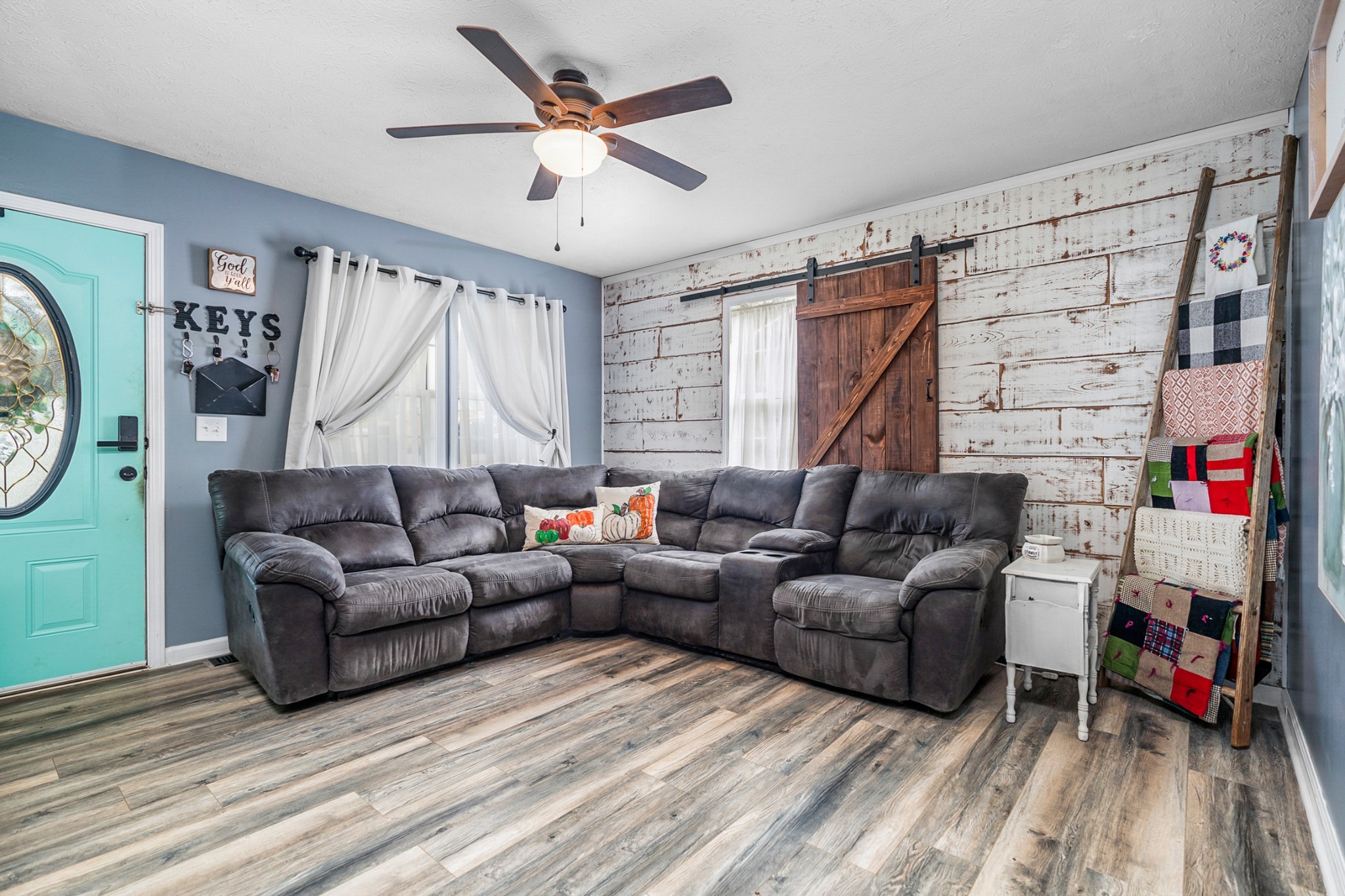 425 South Young Street Sparta, TN 38583 - Photo 2 of 34 a living room with furniture a ceiling fan and a rug