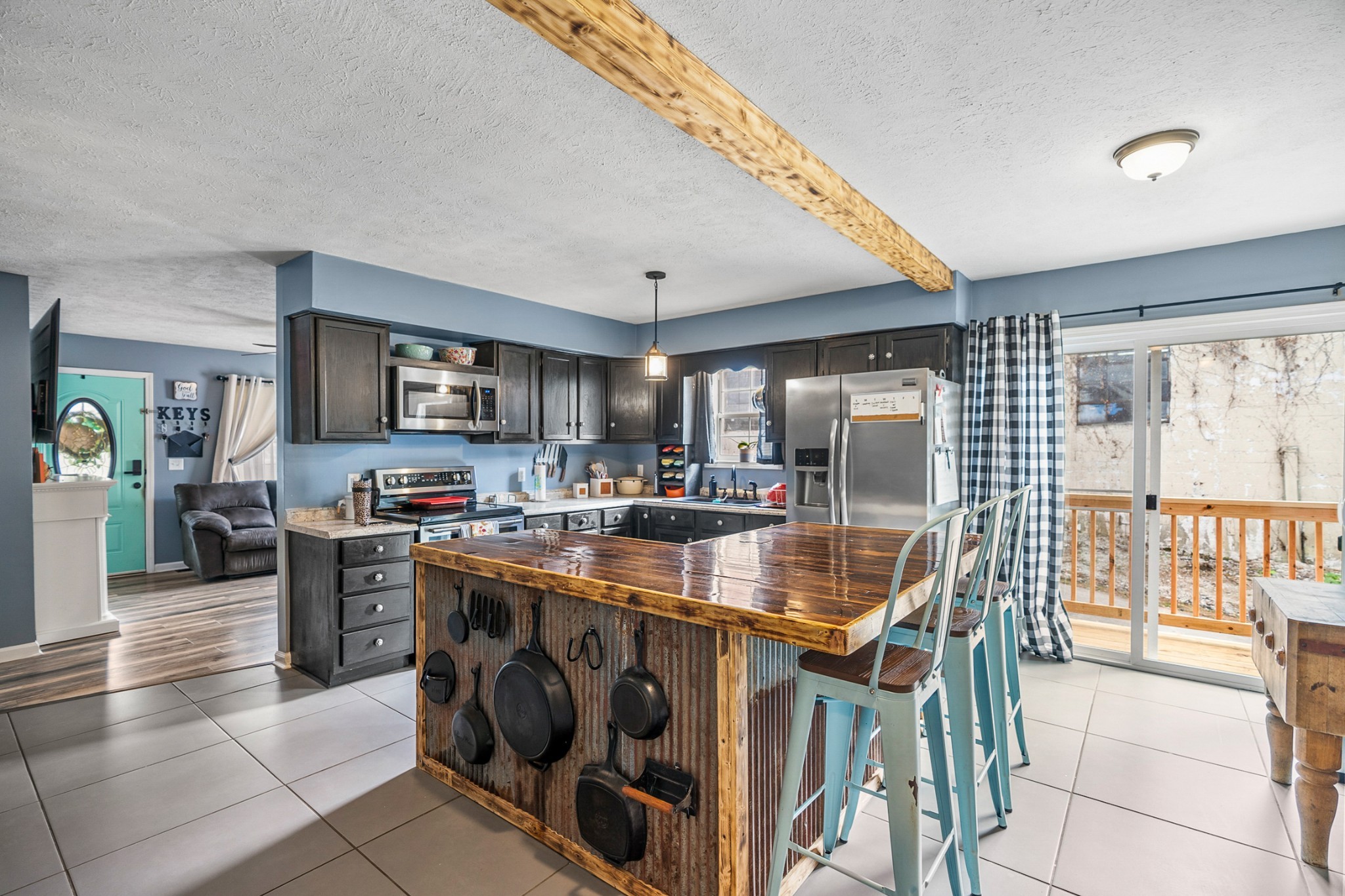 425 South Young Street Sparta, TN 38583 - Photo 3 of 34 a kitchen with stainless steel appliances granite countertop a stove top oven a sink a counter space and cabinets
