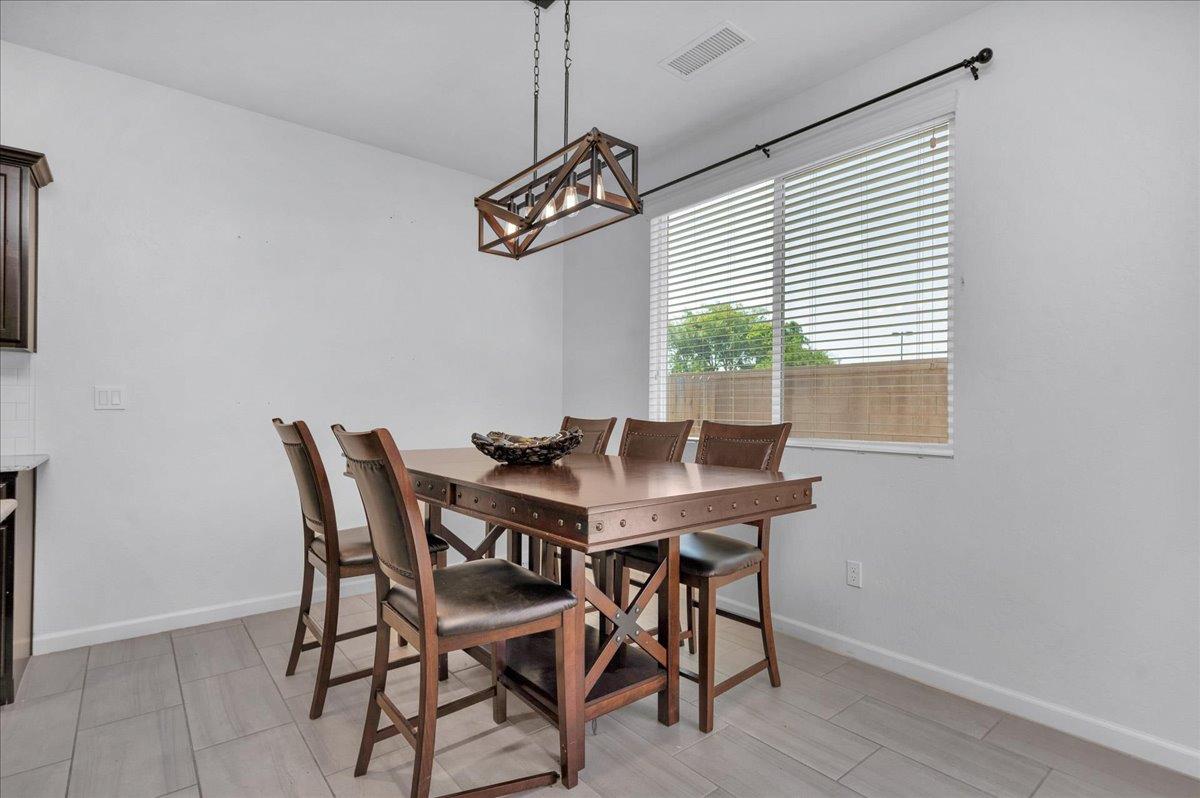 3012 Swift Lane Clovis, CA 93619 - Photo 12 of 40 a view of a dining room with furniture and window