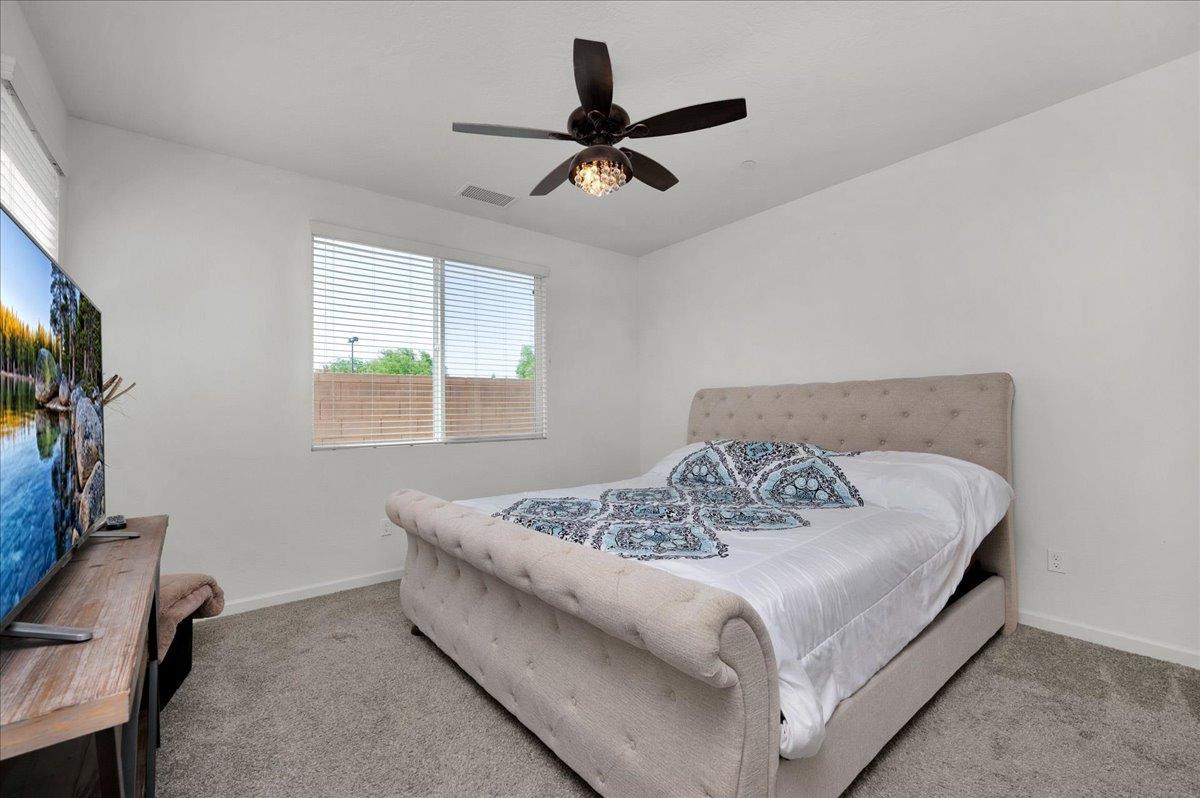 3012 Swift Lane Clovis, CA 93619 - Photo 13 of 40 a bed sitting in a bedroom next to a window
