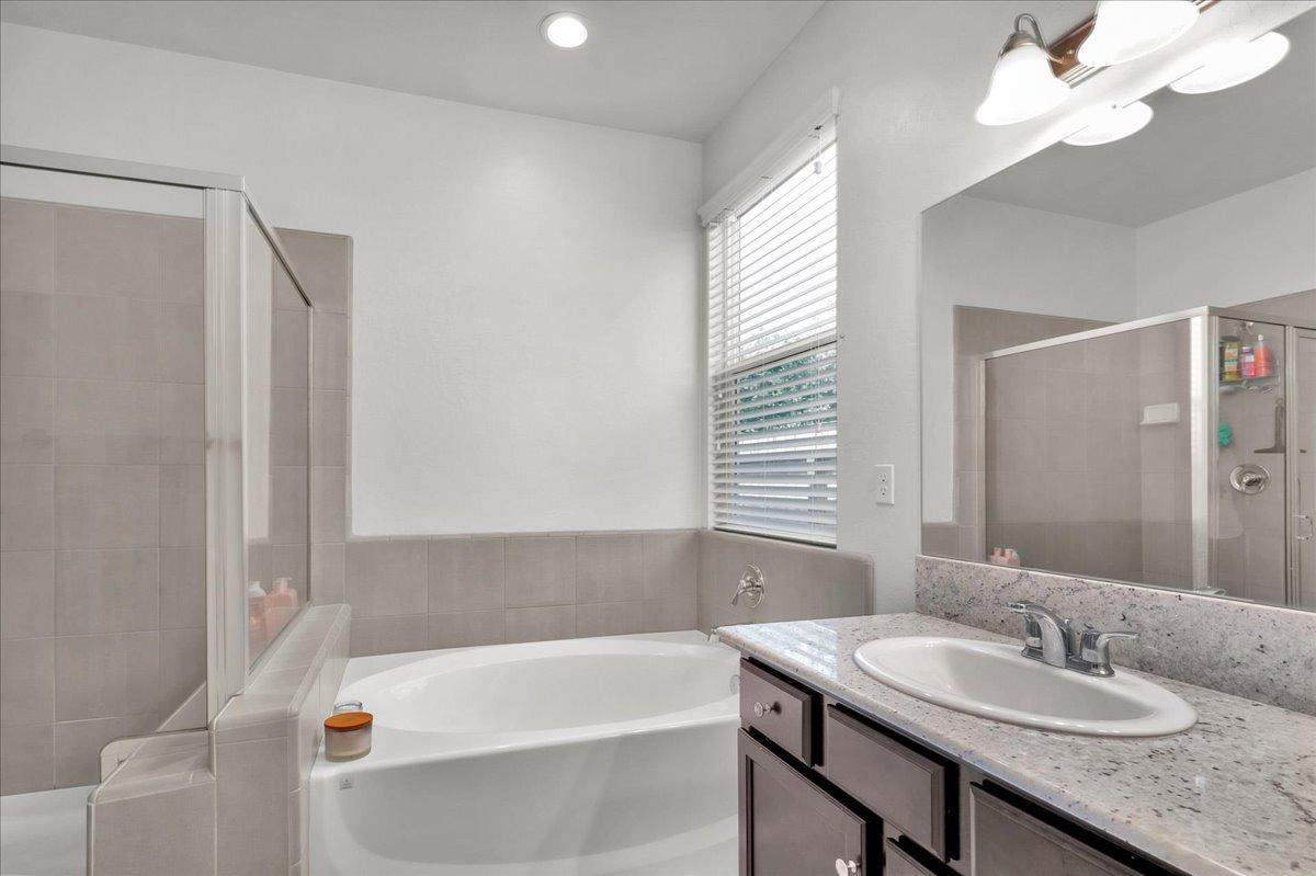 3012 Swift Lane Clovis, CA 93619 - Photo 15 of 40 a bathroom with a granite countertop sink and a mirror