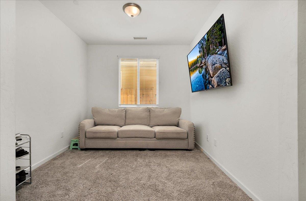 3012 Swift Lane Clovis, CA 93619 - Photo 19 of 40 a living room with furniture and a wall painting