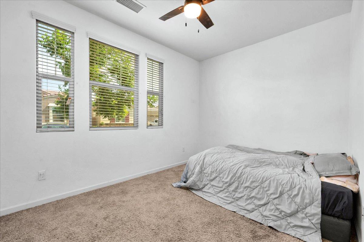 3012 Swift Lane Clovis, CA 93619 - Photo 20 of 40 a bedroom with a bed and a window
