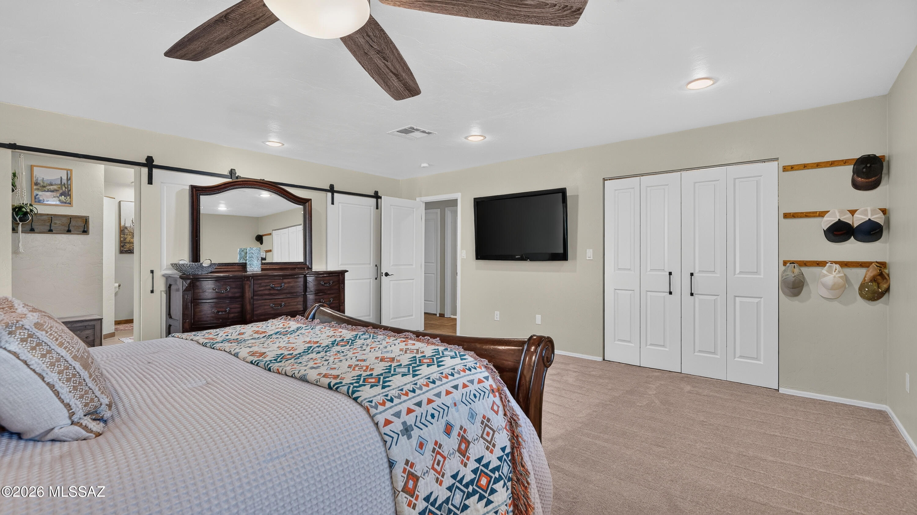 194 Taylor Road Willcox, AZ 85643 - Photo 24 of 54 Primary Bedroom with New Carpet (6.26), Custom Wooden Window Shutters and 2 large Closets, 72" Ceiling Fan and Dimmable Can lighting