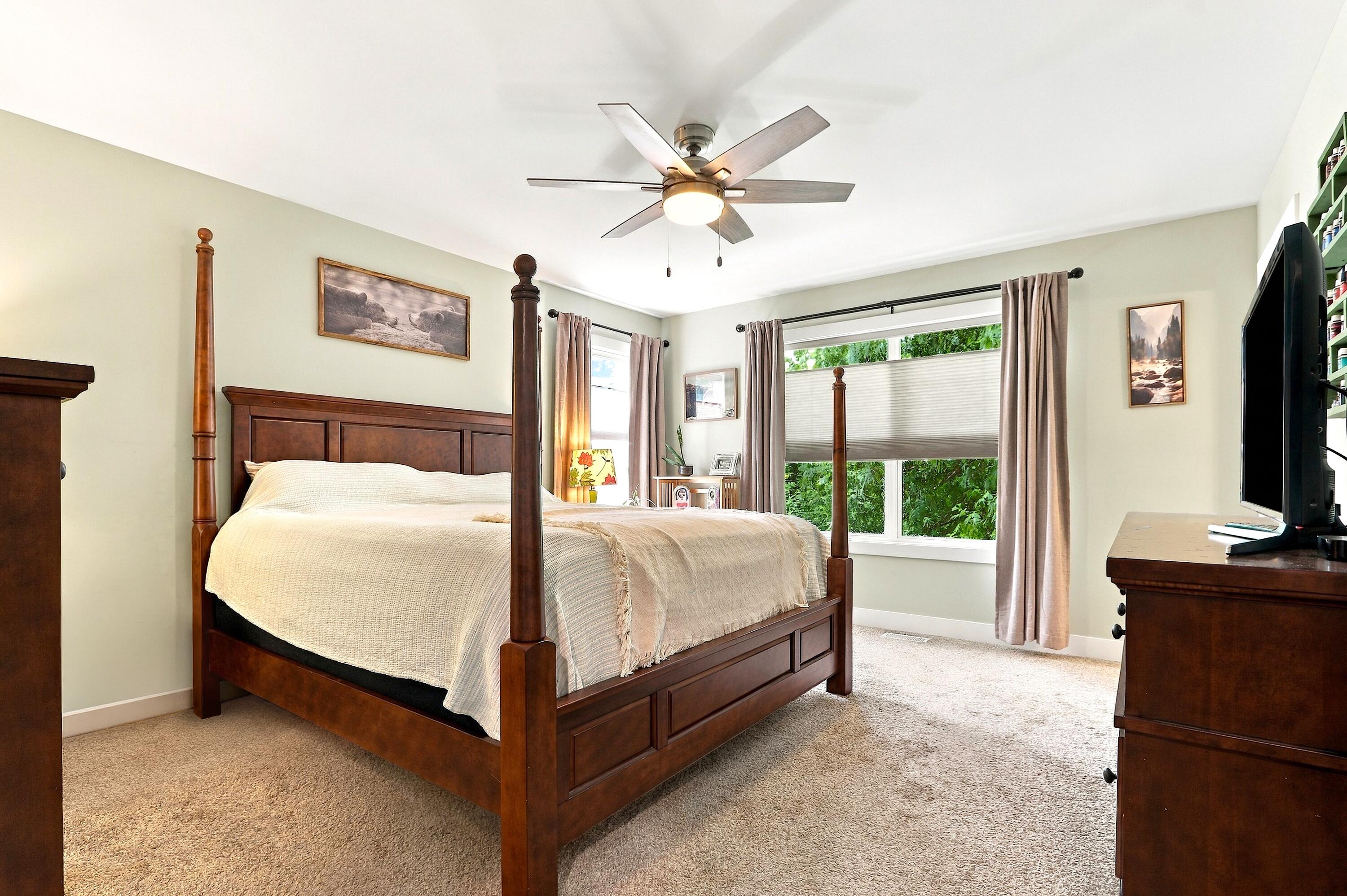 78 Menominee Road Williams Bay, WI 53191 - Photo 14 of 40 The tranquil Primary Suite overlooks the yard and has room for all your favorite bedroom furniture