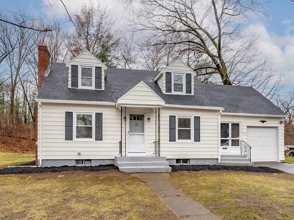 1174 Liberty Street Springfield, MA 01104 - Photo 1 of 34 a front view of a house with a yard