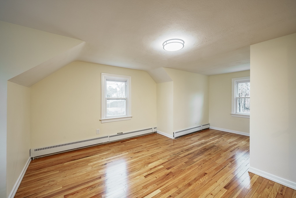 1174 Liberty Street Springfield, MA 01104 - Photo 14 of 34 an empty room with wooden floor and windows