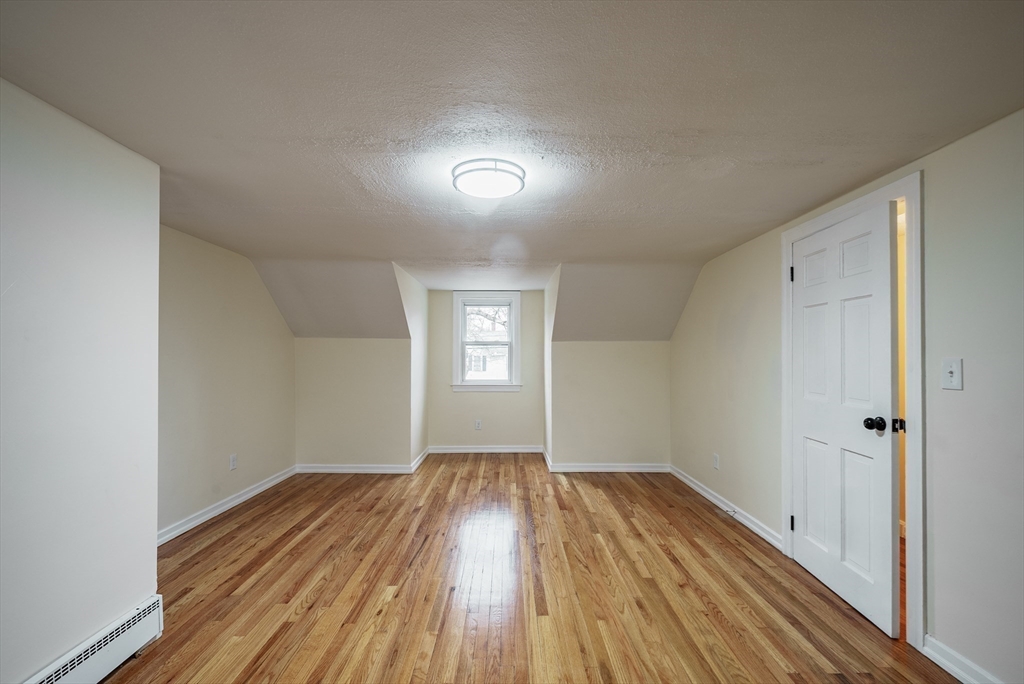 1174 Liberty Street Springfield, MA 01104 - Photo 15 of 34 a view of empty room with wooden floor