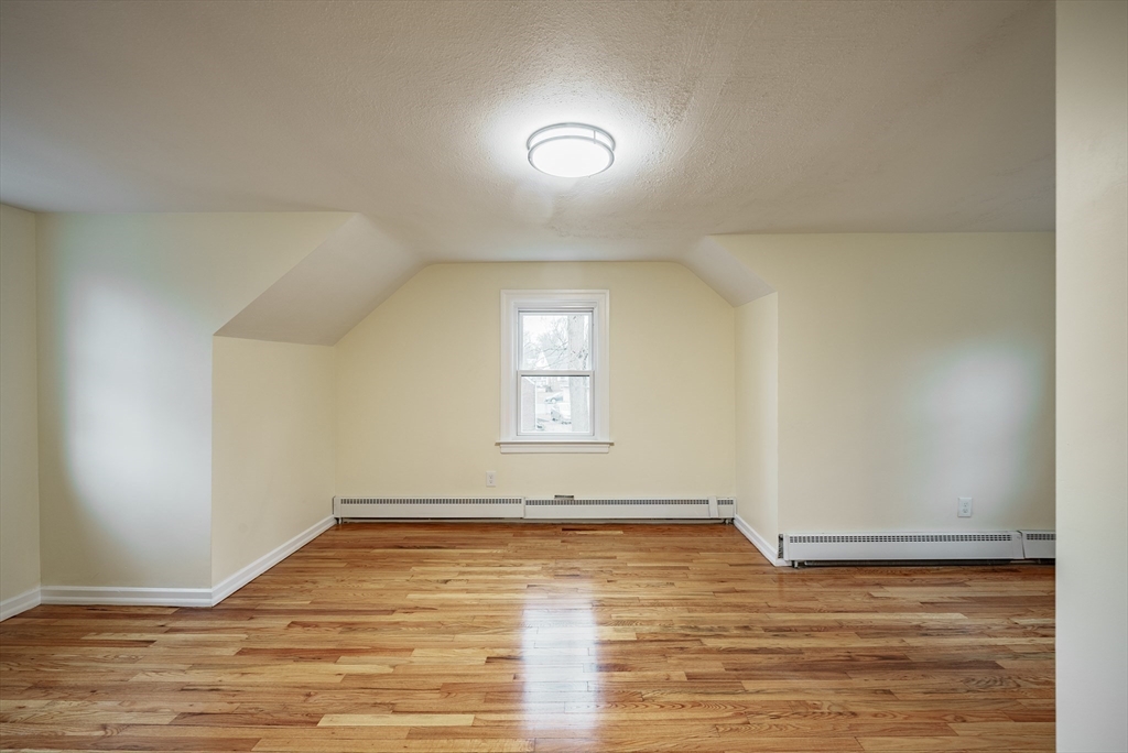 1174 Liberty Street Springfield, MA 01104 - Photo 17 of 34 a view of empty room with wooden floor and fan