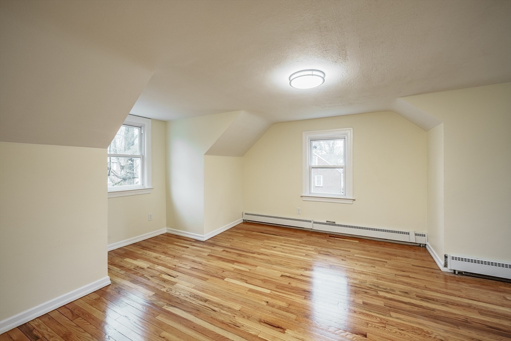 1174 Liberty Street Springfield, MA 01104 - Photo 18 of 34 a view of empty room with wooden floor and fan