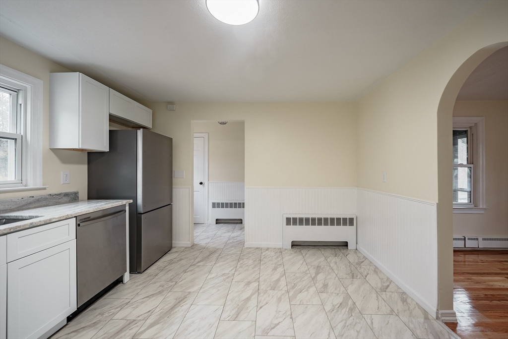 1174 Liberty Street Springfield, MA 01104 - Photo 26 of 34 a kitchen with a refrigerator and a sink