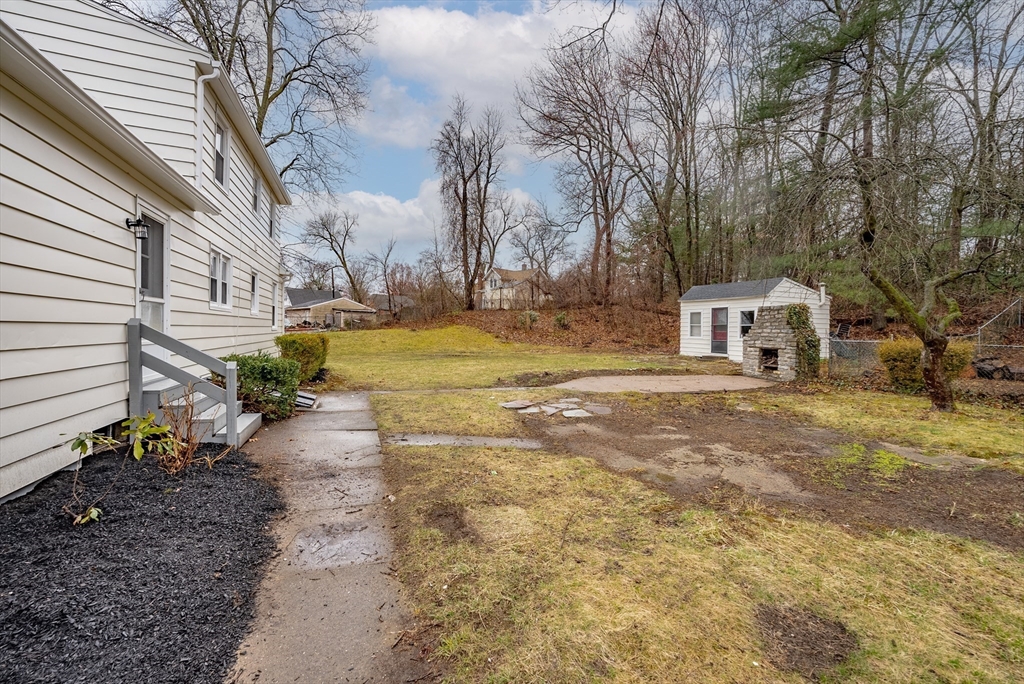 1174 Liberty Street Springfield, MA 01104 - Photo 28 of 34 a view of a house with backyard and trees