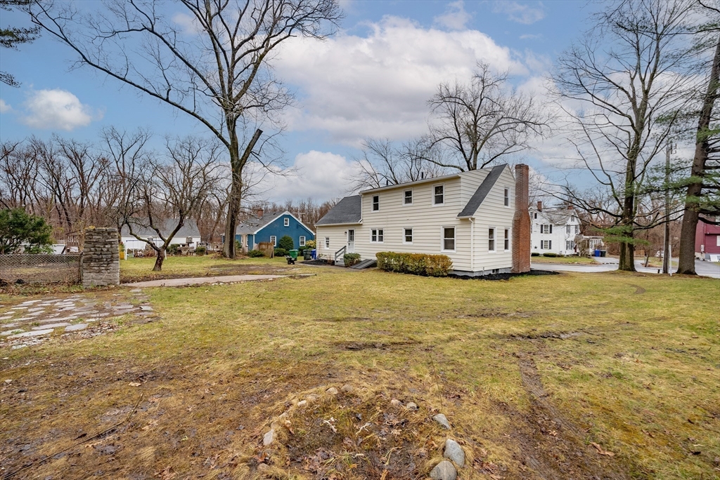 1174 Liberty Street Springfield, MA 01104 - Photo 29 of 34 a view of a white house with a yard