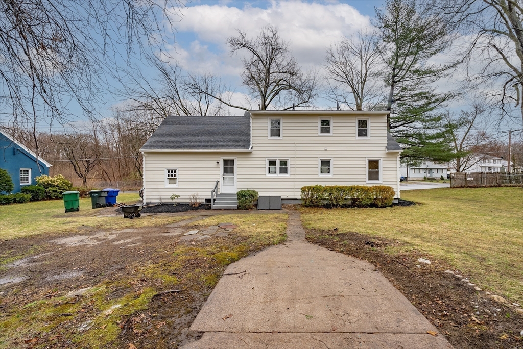1174 Liberty Street Springfield, MA 01104 - Photo 31 of 34 a view of a house with a yard and garage