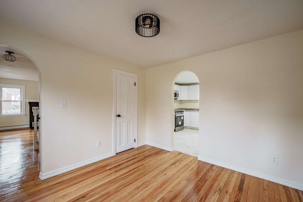 1174 Liberty Street Springfield, MA 01104 - Photo 9 of 34 wooden floor in an empty room with a window