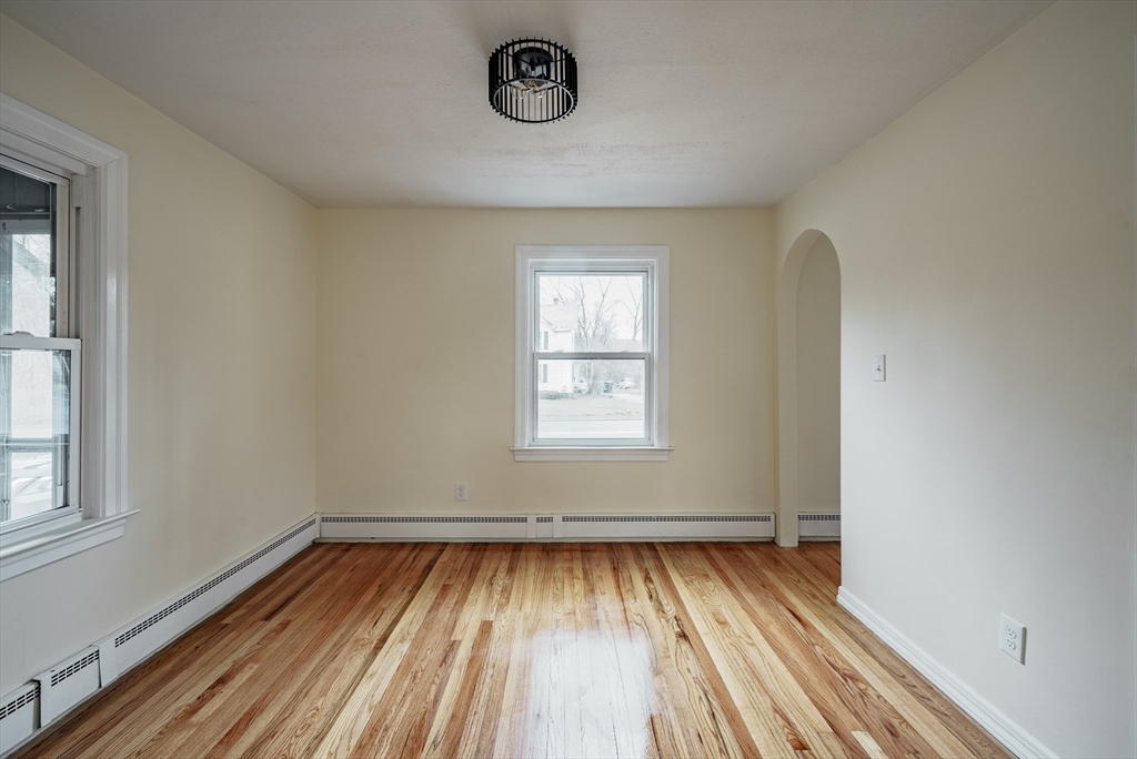 1174 Liberty Street Springfield, MA 01104 - Photo 10 of 34 an empty room with a window