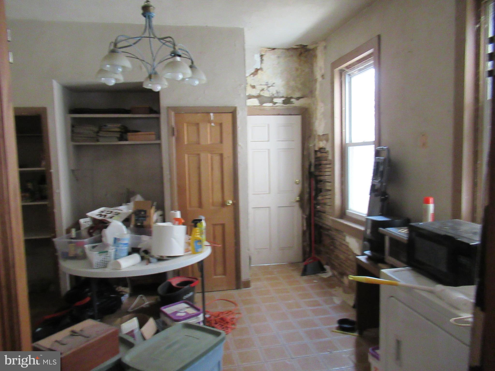 4953 Hawthorne Street Philadelphia, PA 19124 - Photo 3 of 9 a view of a dining room with furniture and chandelier