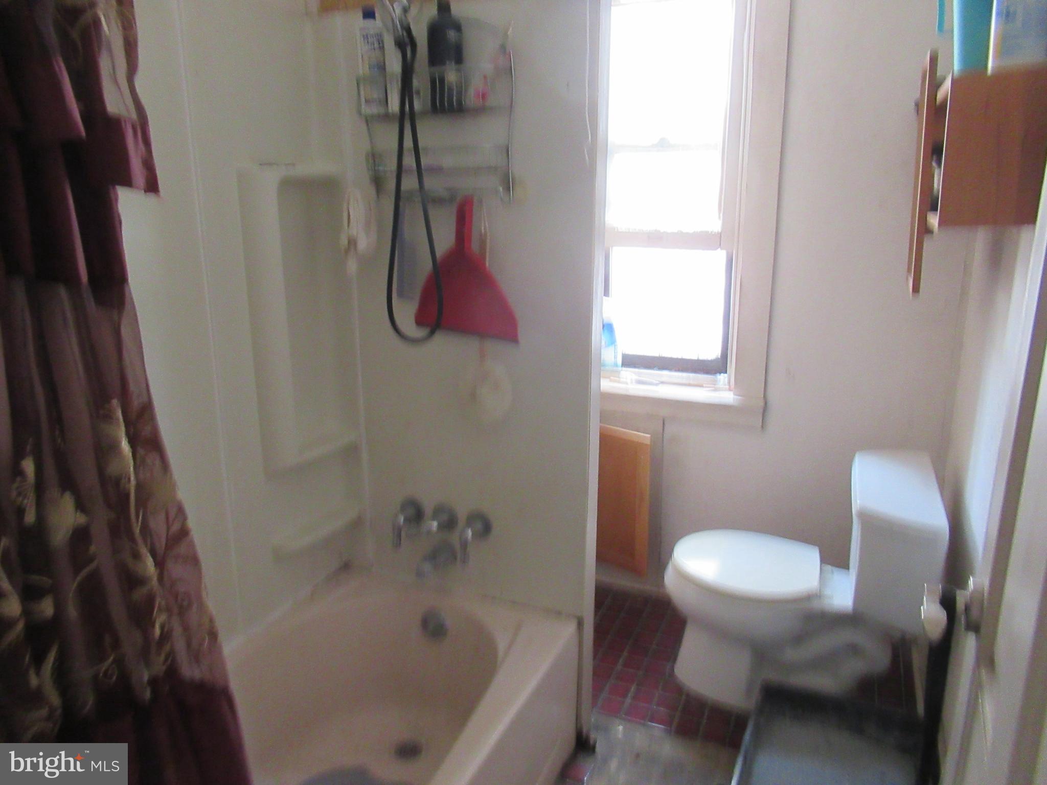 4953 Hawthorne Street Philadelphia, PA 19124 - Photo 5 of 9 a bathroom with a sink and a toilet