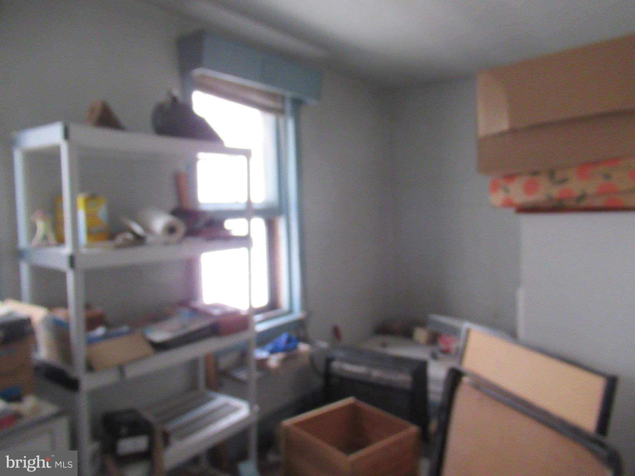 4953 Hawthorne Street Philadelphia, PA 19124 - Photo 6 of 9 a room with furniture and window