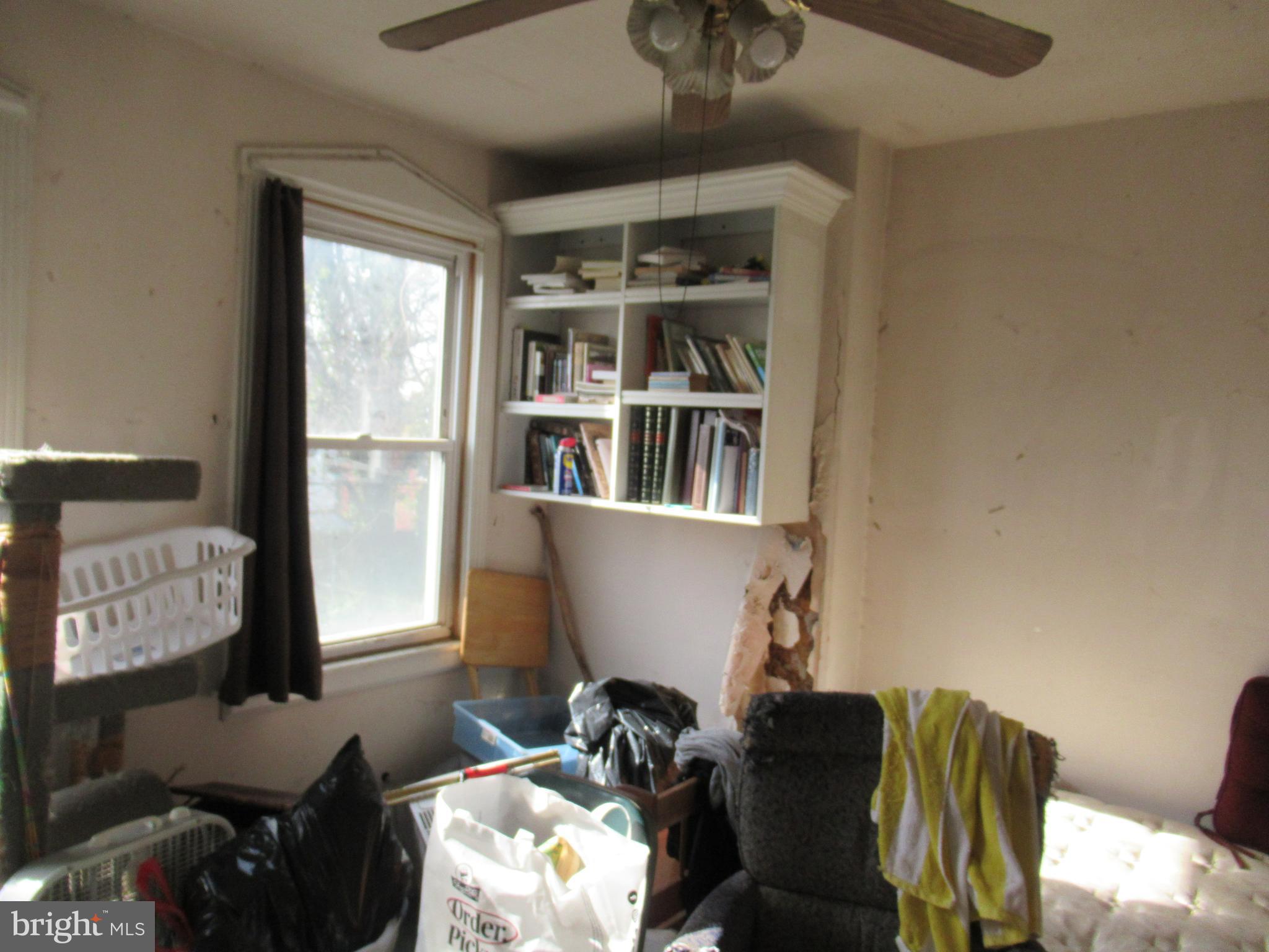 4953 Hawthorne Street Philadelphia, PA 19124 - Photo 8 of 9 a view of a workspace with furniture and a window